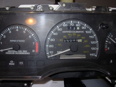 1995 Ford Taurus - Close-up of a vehicle's instrument cluster, showing RPM, speed, and mileage readings.