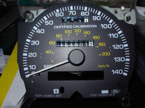 1995 Ford Taurus - A car's dashboard gauge cluster is shown, displaying speed and mileage.