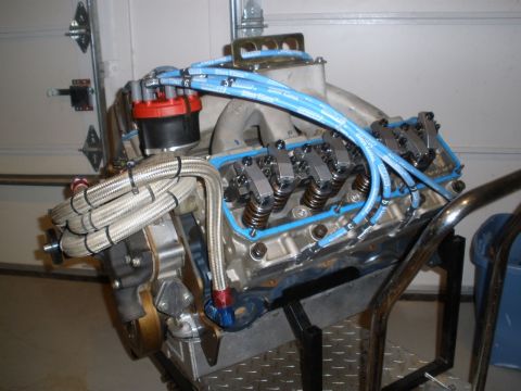 1995 Ford Bronco - Close-up of a V8 engine assembly, showing the valve covers and ignition system.