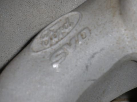 1995 Ford Bronco - Cast metal part with Ford logo and casting numbers visible.