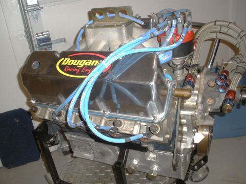 1995 Ford Bronco - Engine part with a chrome valve cover and a sticker for Dougan's Racing Engines.