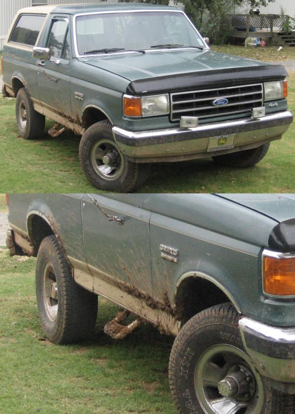 Green 1989 Ford Bronco with a white top, covered in mud