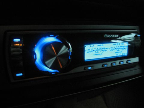 1989 Ford Bronco - A close-up view of a Pioneer car stereo system with its display and controls illuminated.