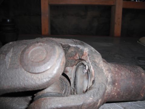 1991 Ford Bronco - This is a close-up view of a worn universal joint, likely from a vehicle's drivetrain.