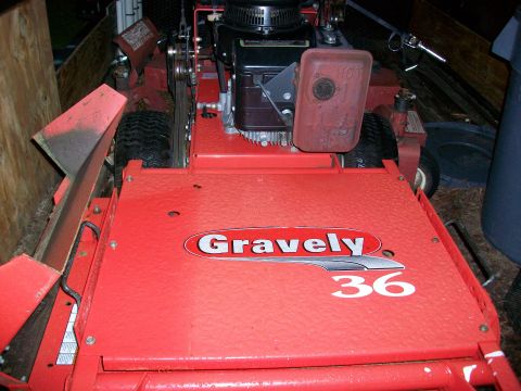 1983 Ford F-250 - Gravely 36 walk-behind mower deck and engine shown in a trailer.