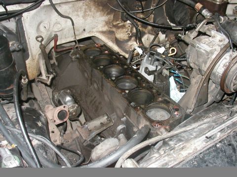 1990 Ford Taurus - The engine block is exposed, showing the cylinders and surrounding mechanical components.