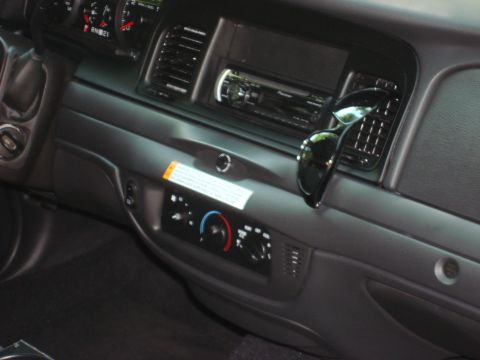 2006 Ford Crown Victoria - Interior view of a 2006 Ford Crown Victoria dashboard, showing the stereo and climate controls.