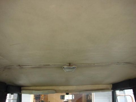 1972 Land Rover Land Rover - Headliner and upper windshield view inside a vehicle, showing the dome light.