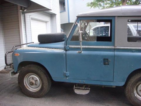 1972 Land Rover Land Rover - This 1972 Land Rover Land Rover is seen from a 3/4 front angle, a blue body and grey hardtop.