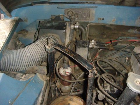 1972 Land Rover Land Rover - Engine bay details of a 1972 Land Rover Land Rover, including the distributor and air intake system.
