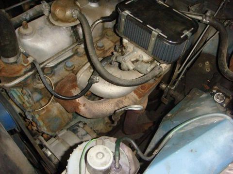 1972 Land Rover Land Rover - Engine bay detail showing an engine with an aftermarket air filter and carburetor.