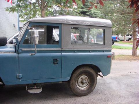 1972 Land Rover Land Rover - A blue 1972 Land Rover Land Rover is parked outdoors, with other vehicles visible in the background.