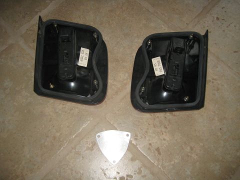 1993 Ford Probe - Two car taillights are shown, with labels indicating part numbers 600L 516 915 7009 and H1 H3 915 7009.