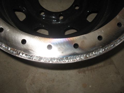 1979 Ford F-150 - A close-up view of a modified wheel rim, showing the details of its construction and finish.