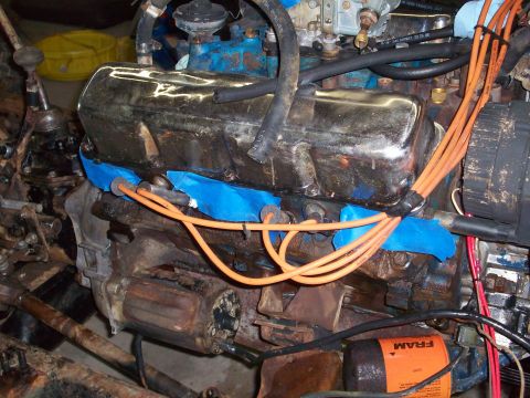 1978 Jeep CJ5 - Close-up view of a V8 engine, showing spark plug wires and an oil filter.