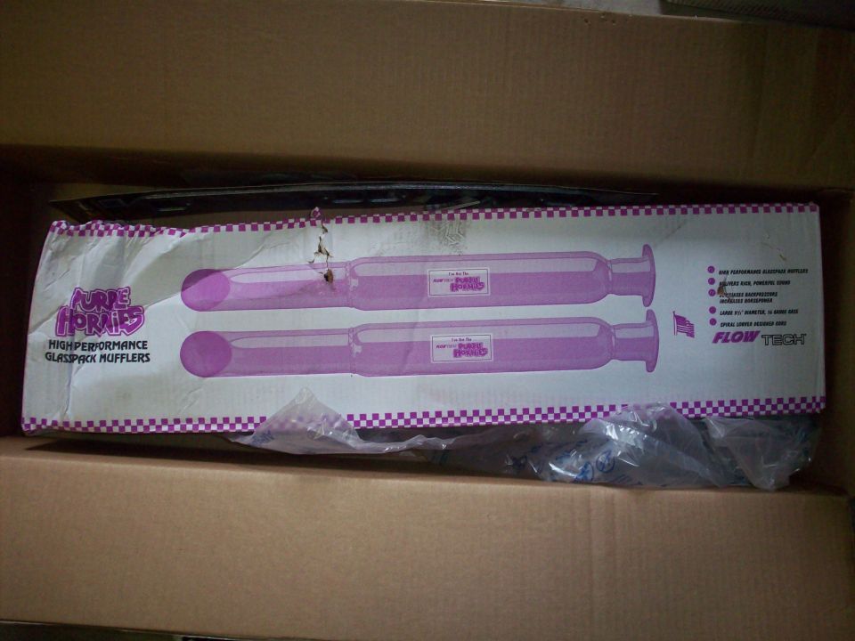 Box containing two Flowtech Purple Hornies high-performance glasspack mufflers