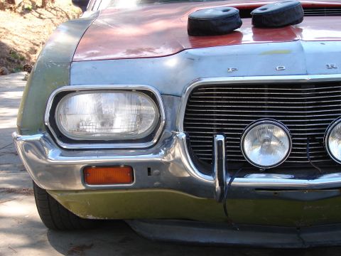 1973 Ford Ranchero - The front grille and headlights of a 1973 Ford Ranchero, showing its distinctive styling.