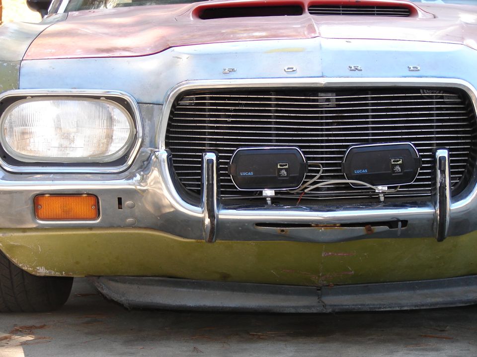 1973 Ford Ranchero front end with chrome bumper, grille, and aftermarket Lucas lights