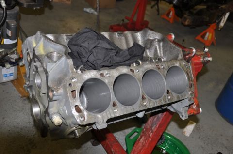 1996 Ford Bronco - Close-up of a machined engine block, ready for assembly in a workshop setting.