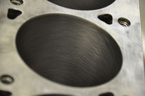 1996 Ford Bronco - Close-up of a machined engine cylinder bore showing cross-hatching from the honing process.