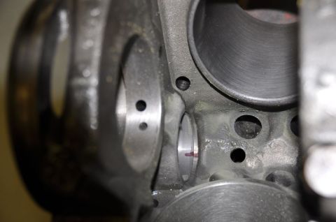 1996 Ford Bronco - Close-up view of an engine block's cylinder bore, showing honing marks and oil passages.