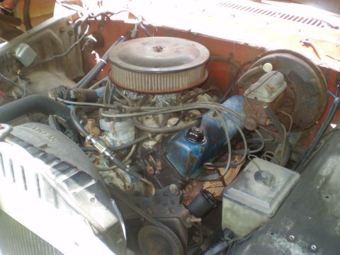 1979 Ford Bronco - Close-up view of the engine compartment, showing various mechanical components and wiring.
