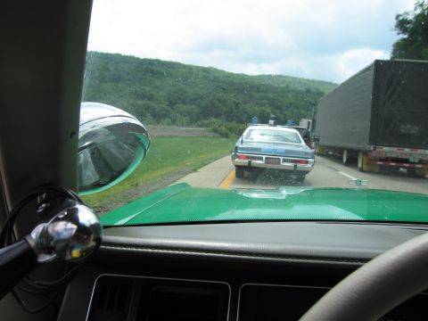 1991 Ford Crown Victoria - A 1991 Ford Crown Victoria police car is seen from the perspective of another vehicle on the highway.