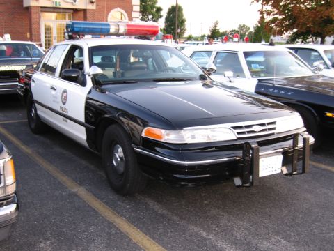 1991 Ford Crown Victoria - This 1991 Ford Crown Victoria police car features a black and white paint scheme and a push bar on the front.