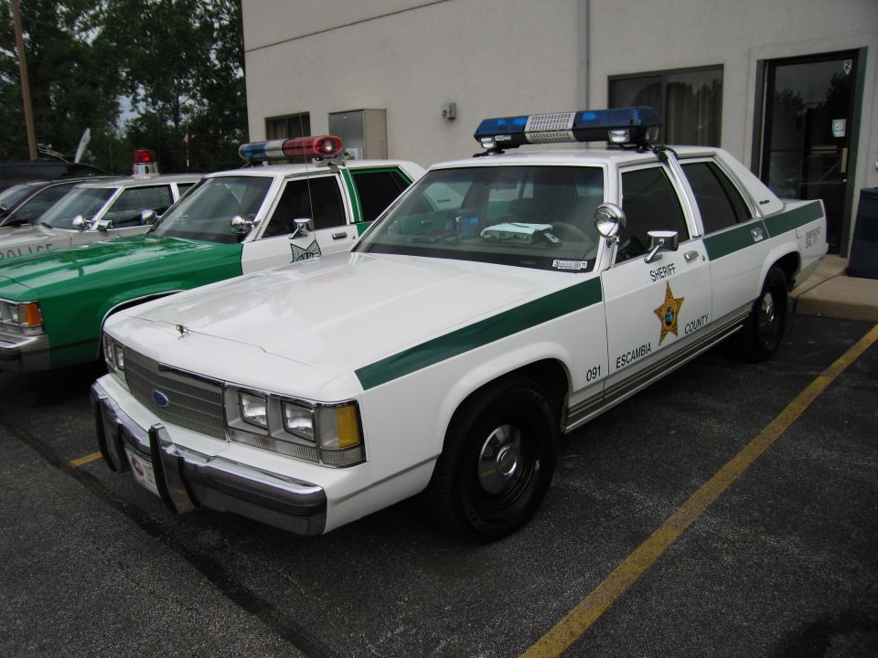 White-and-green Ford LTD Crown Victoria Escambia County Sheriff car, unit 091