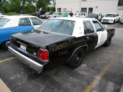 1991 Ford Crown Victoria - This 1991 Ford Crown Victoria police car, marked "CANINE PATROL", is seen from the rear three-quarter angle.