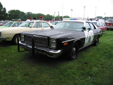 1991 Ford Crown Victoria - A police car with 'Highway Patrol' markings sits on a grassy field, with other vehicles and tents in the background.