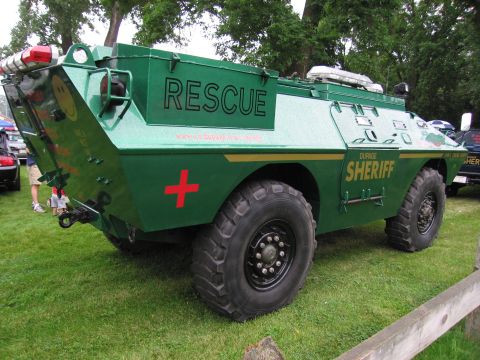 1991 Ford Crown Victoria - Armored rescue vehicle with 'DUPAGE SHERIFF' markings is parked on grass.