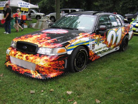 1991 Ford Crown Victoria - Customized 1991 Ford Crown Victoria with flame graphics and police livery details.