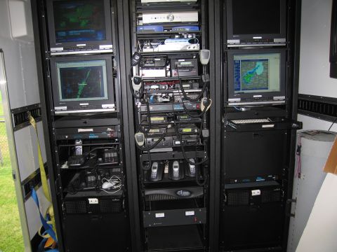 1991 Ford Crown Victoria - An electronic equipment rack filled with various communication and monitoring devices.