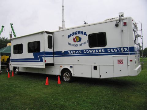 1991 Ford Crown Victoria - A white RV serves as a mobile command center for Mokena Emergency Services, blue stripes and various communication equipment.