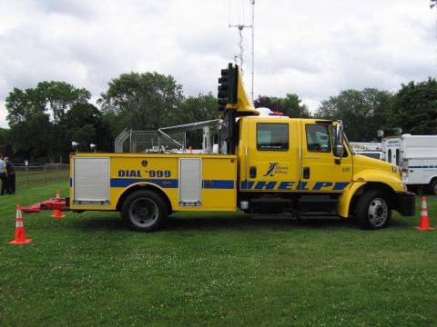1991 Ford Crown Victoria - This yellow utility truck is equipped with traffic signal equipment and emergency service markings.