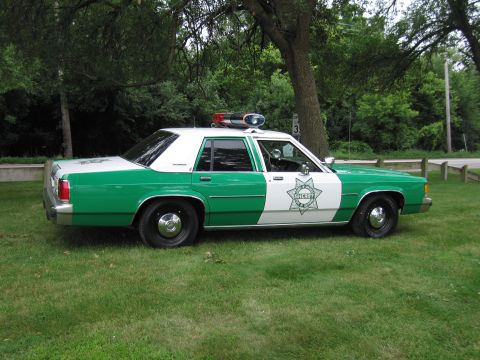 1991 Ford Crown Victoria - This 1991 Ford Crown Victoria is painted green and white with 'SHERIFF' markings.