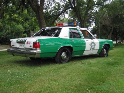 1991 Ford Crown Victoria - This 1991 Ford Crown Victoria police car is marked with 'SHERIFF' and 'EMERGENCY 911'.