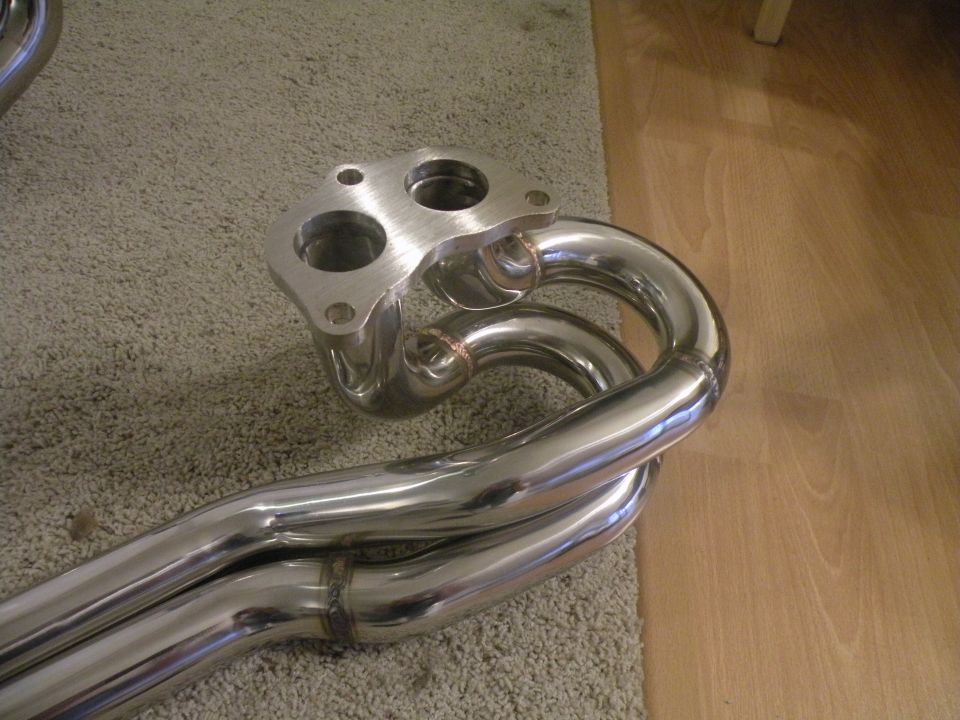 Polished stainless steel exhaust manifold with a two-bolt flange