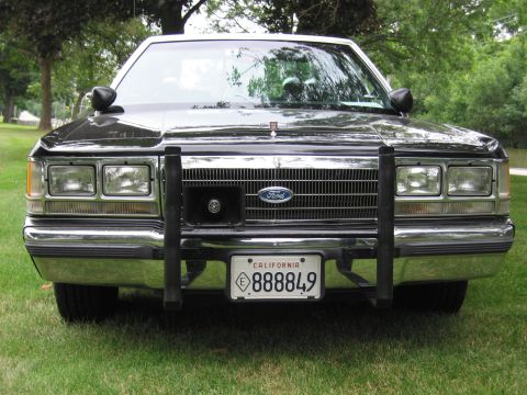 1991 Ford Crown Victoria - This Ford Crown Victoria police car features a prominent push bar and a California license plate.