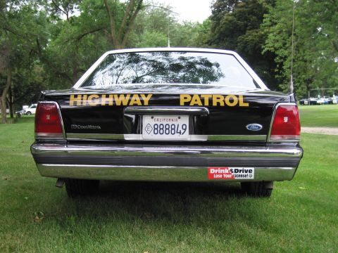 1991 Ford Crown Victoria - This Ford Crown Victoria is marked as a Highway Patrol vehicle and has a 'Drink & Drive Lose Your License!' bumper sticker.