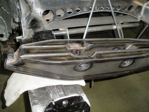 1995 Ford Bronco - Welded metal suspension components are examined, with a watermark indicating the source as SuperMotors.net.
