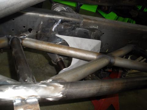 1995 Ford Bronco - Close-up view of custom suspension components and frame modifications.