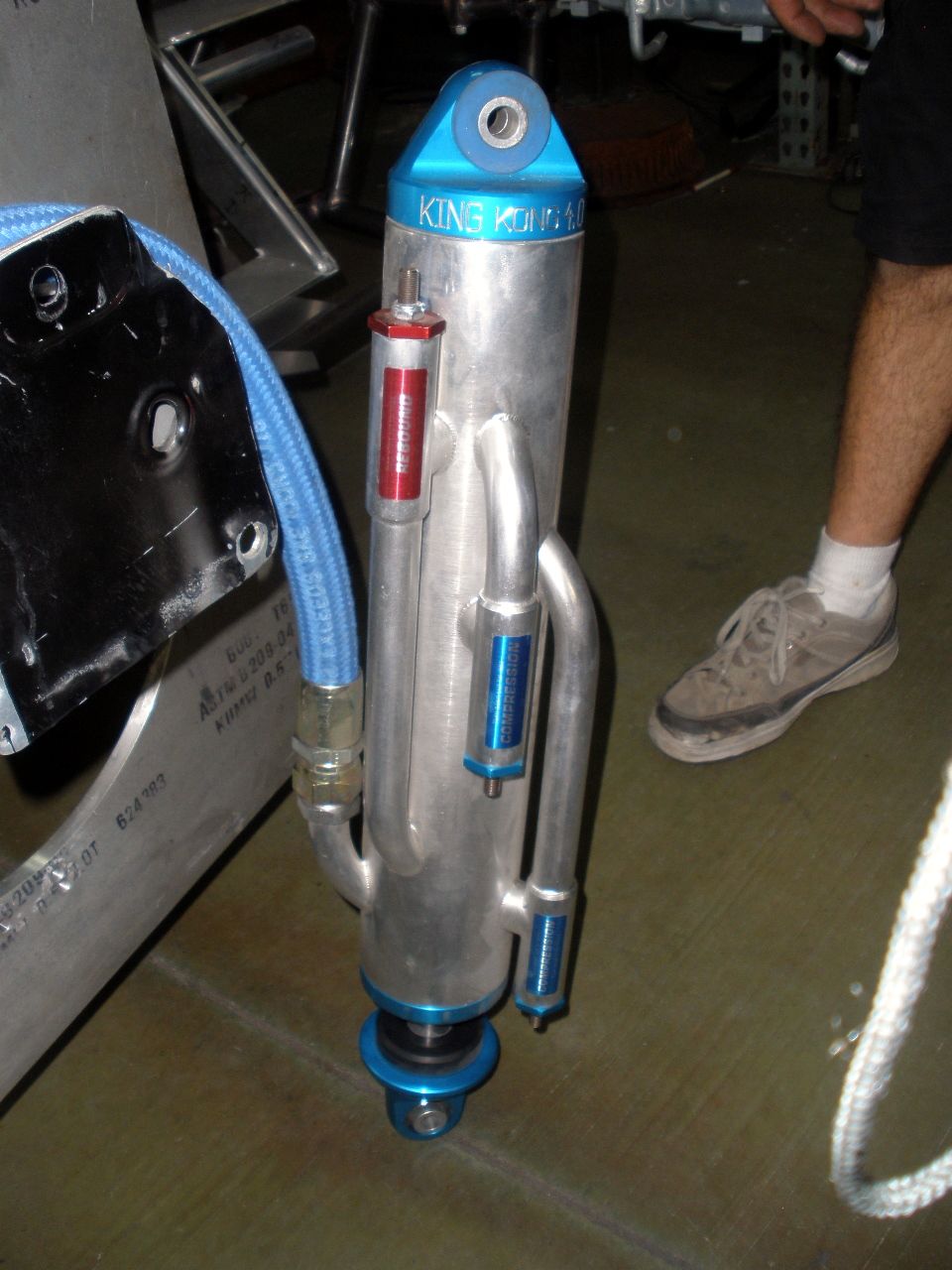 King Off-Road Racing shock absorber with blue top and reservoir. Part number visible on a red label