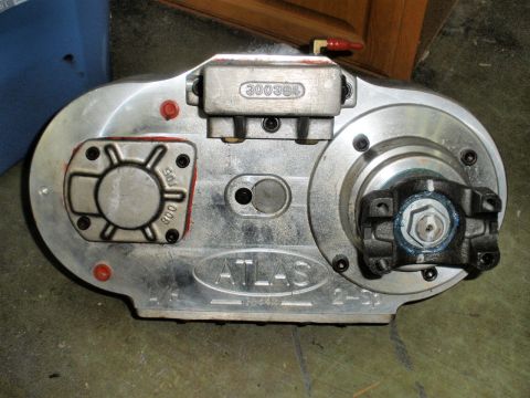 1995 Ford Bronco - A close-up view of an Atlas transfer case, showing various markings and components.