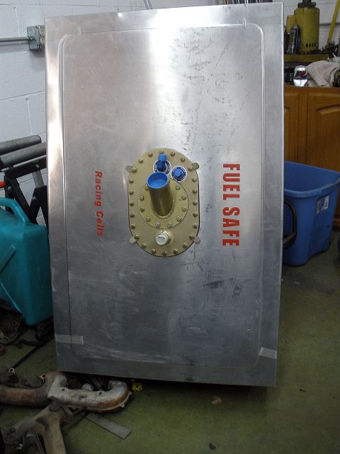 1995 Ford Bronco - A large metal fuel safe is shown with text indicating it is for racing cells.
