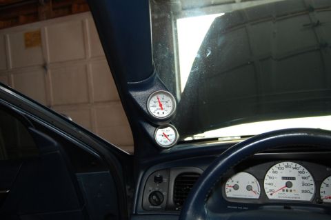 1985 Mercury Grand Marquis - Aftermarket gauges installed in the A-pillar of a 1998 Mercury Grand Marquis, alongside the factory dashboard instruments.