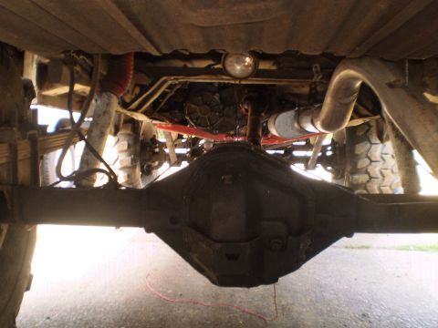 1978 Ford Bronco - This image shows the underside of a vehicle, focusing on the rear differential and exhaust components.