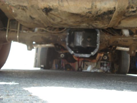 1990 Ford Bronco - Underside view of a vehicle's rear differential, with a "SUPERMOTORS.NET" watermark visible.