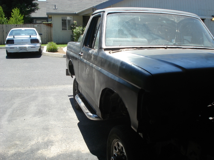 Black Ford Bronco, unfinished body, side view with chrome step bars